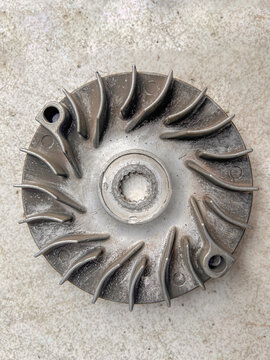 Aluminum CVT variator drive face cooling fan pulley for scooter engine.