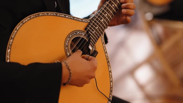 Musician playing a Portuguese guitar, creating fado music, hand strumming strings with a pick, producing melodic sound