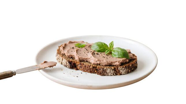 P&acirc;t&eacute; on rye bread with herbs on white plate