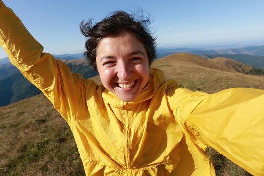 The Yellow Jacket Selfie on Sunlit Mountain Ridge With Open Sky