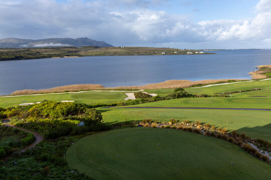 Beautiful golf course landscape by a tranquil lake