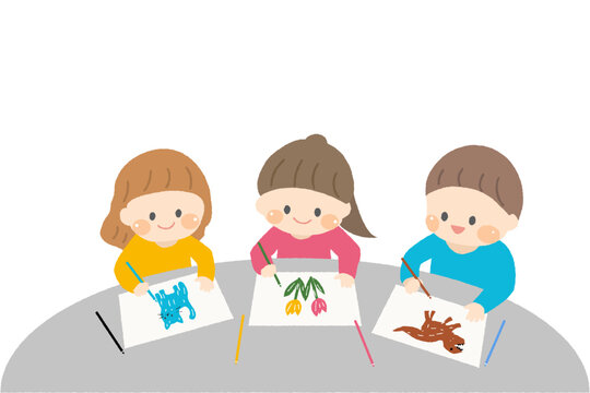 テーブルでお絵描きをする3人の子どもたち