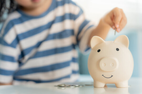 Save money. children putting coin for saving. wealth, Finance, insurance, investment, education, future, plan life, learn, banking, family, health, health and accident insurance.