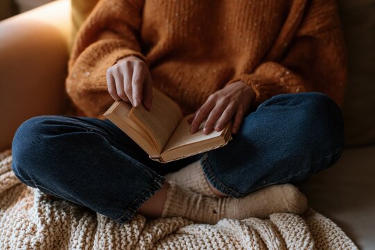 The Cozy Book Reading Moment With Warm Sweater And Soft Blanket