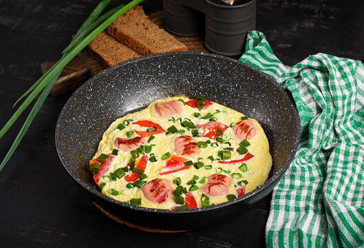 Hearty Breakfast Omelet Served in Frying Pan