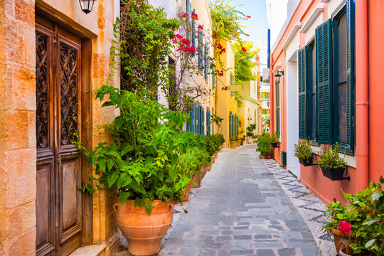 Cozy street with colorful architecture and flowers in Rhodes island, Greece. Beautiful summer cityscape.