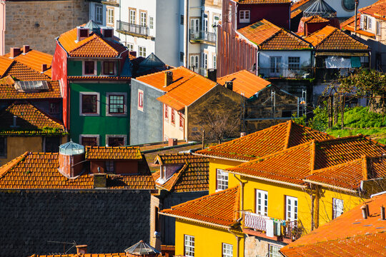 Old architecture with red tile rooftops in Porto, Portugal. Beautiful autumn cityscape.