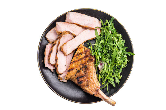 Succulent grilled Tomahawk pork chop, rib bone in steak featuring crispy edges and juicy meat that will tantalize your taste buds. isolated on white background. top view