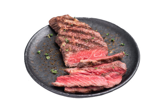Grilled New York Striploin steak, perfectly seared with beautiful grill marks, showcasing its juicy tenderness and rich flavor. isolated on white background. top view