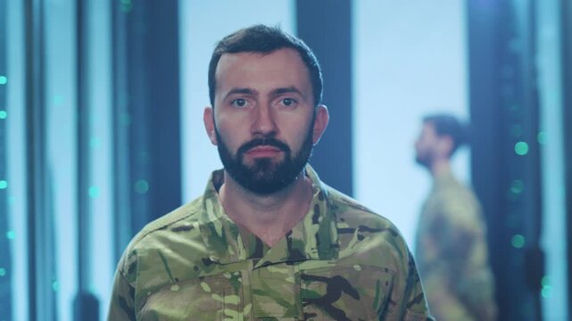 Soldier analyzing electronics, Service member in uniform assessing sophisticated digital infrastructure environment