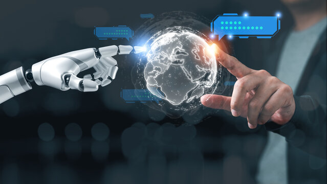 Human and robot hands connect around a digital globe, representing artificial intelligence, global technology, automation, communication, innovation and human AI collaboration.