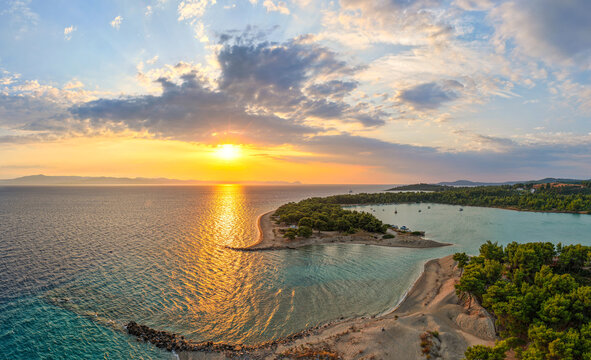 Aerial view of Glarokavos Lagoon Beach and Aegean Sea at sunrise in Halkidiki
