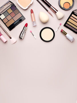 Vertical view empty space cosmetics frame, beauty items collection.Makeup accessories.