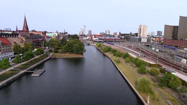 Malm&ouml; city, purple train departing from central station, summer day