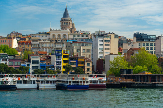 Panoramic view of galata tower and colorful urban buildings along the golden horn waterfront in istanbul turkey