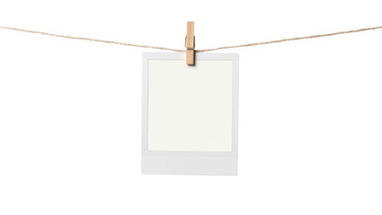 Blank instant photo frame clipped to twine, isolated on transparent background © Noah