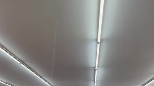 Low angle view of modern parallel linear ceiling lights texture