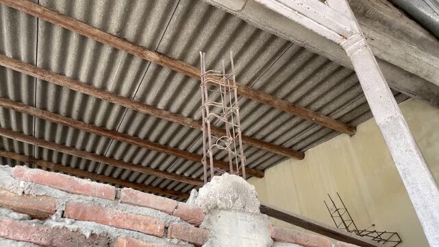 Low angle view of steel rebar column inside a house construction site