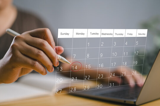 Businessman manages time for effective work. Calendar on the virtual screen interface. Highlight appointment reminders and meeting agenda on the calendar. Time management concept.
