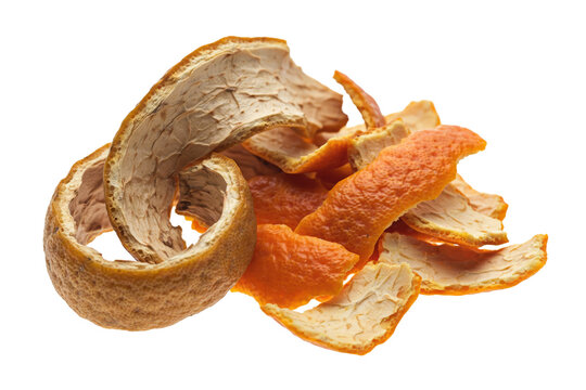 Dried orange peels arranged in a pile with textured rind surfaces and white pithy undersides isolated on a transparent background