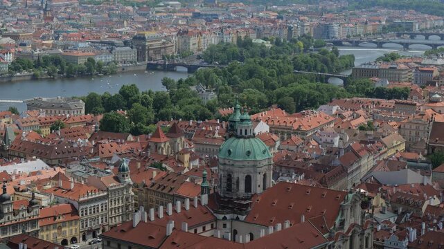 City of Prague cityscape in Czech Republic. Zoom out from dome of St. Nicholas Church in the Lesser Town (Mala Strana).