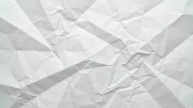 White crumpled and wrinkled paper texture background with creases
