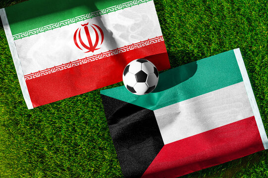 Iran vs. Kuwait football match. National flags on green grass with soccer ball in the middle. Football background for international match.