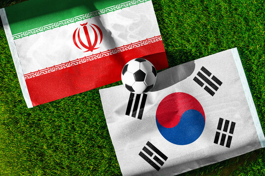 Iran vs. South Korea football match. National flags on green grass with soccer ball in the middle. Football background for international match.