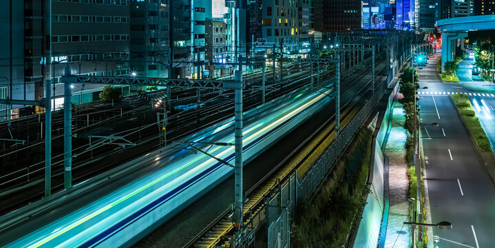 High Speed Train Light Trails Across Tokyo Rail Corridor