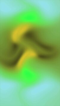 Abstract blurred background with soft gradients of green yellow and light blue colors.