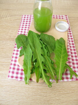 A bottle of freshly pressed dandelion leaf juice
