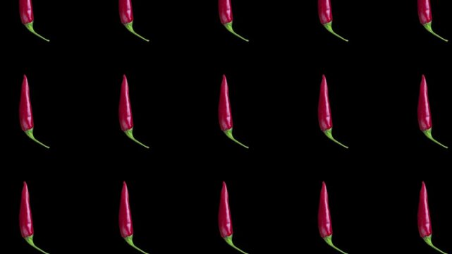 A culinary background featuring spicy red peppers with rotation. On a black background. 4K