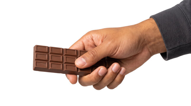 Milk chocolate bar with smooth rectangular segments held between thumb and fingers as an isolated transparent background PNG