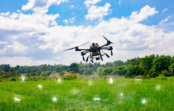 Agricultural drone flying over green field with smart farming and agritech icon interface. Concept of modern precision agriculture, crop management, automation, and sustainable farming technology.
