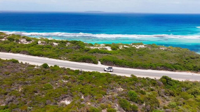 A 4x4 driving along Esperance coast, filmed with a drone
