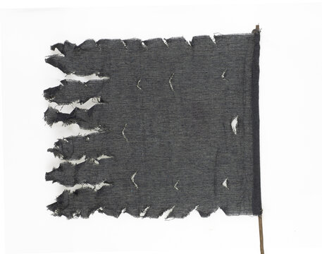 Black tattered pirate flag isolated on a white background