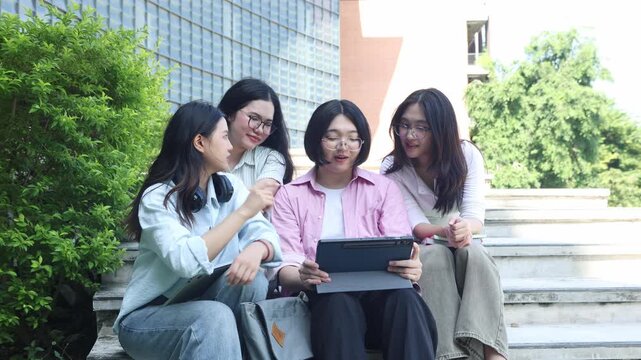 Student meeting area steps in front university building serves spot where friends gather chat review lessons together laptops strengthening friendships and bonds university community.