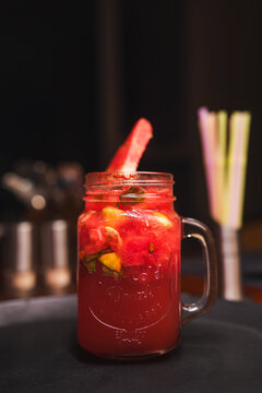 Refreshing and colorful healthy cool drinks served with fresh lemon slices and watermelon garnish. A vibrant summer beverage concept representing freshness, hydration, natural ingredients, healthy lif