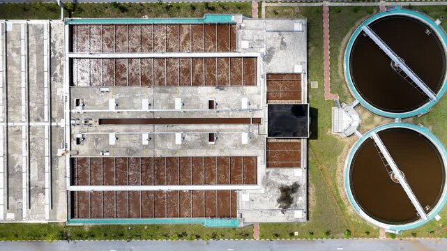 aerial view of wastewater treatment plant circular clarifiers and rectangular aeration tanks