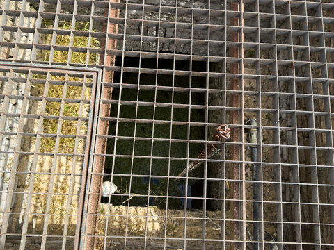 metal grid background underground hatch
