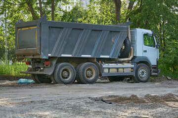 Construction transport.Big dump truck carrying bulk cargo © Igor