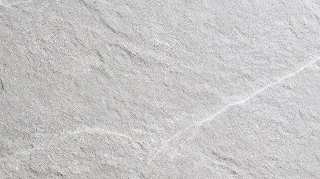 Macro photograph of a light gray textured stone surface