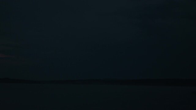 Lightning flashes in the night sky