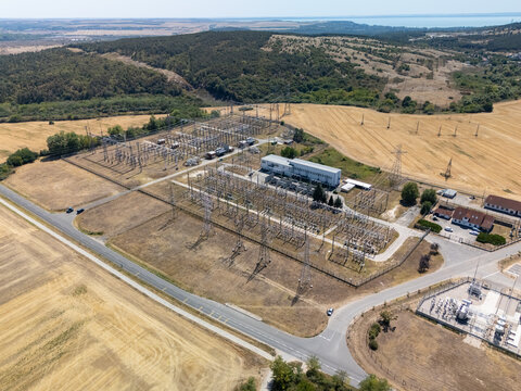 Aerial view of gas turbine plant and substation in rural Hungary fields
