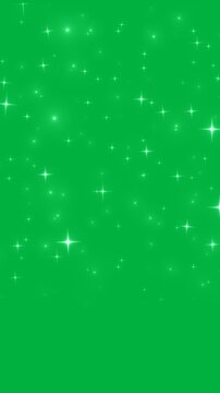 Falling white glowing twinkle stars glitter rain over green screen seamless vertical loop 4k portrait video