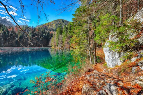 Stunning view of Fusine lake with Mangart peak on background.