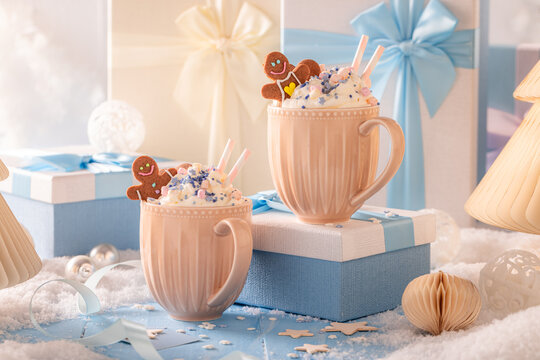 Hot chocolate served with gingerbread creating a warm home atmosphere.