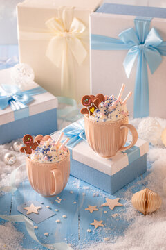 Cozy seasonal atmosphere defined by hot chocolate and gingerbread treats.
