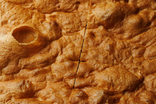 Golden Baked Focaccia Bread Texture with Crispy Crust in Extreme Close Up