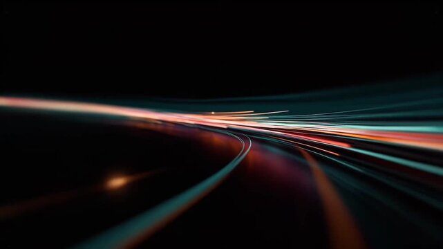 Abstract light trails moving in a curved motion against a dark background